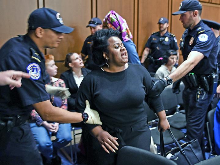Protesters stand up to Brett Kavanaugh during his Senate confirmation hearing