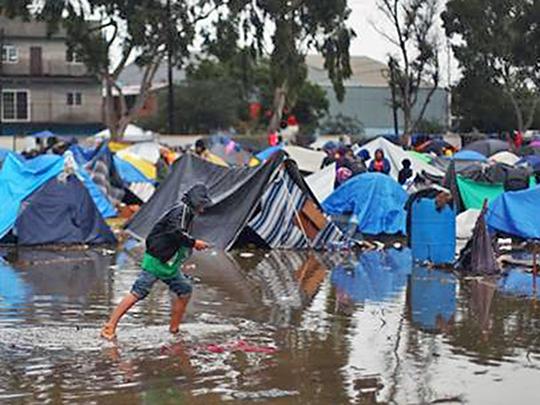 A refugee camp is flooded by rainfall in Tijuana, Mexico