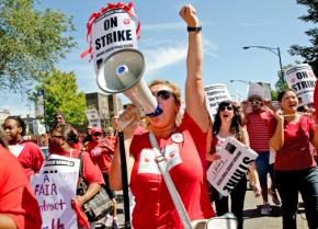 CTU members and supporters join in a mass march to Marshall High School on the West Side